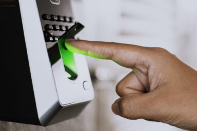 Scanning finger on a coronavirus contaminated fingerprint access control